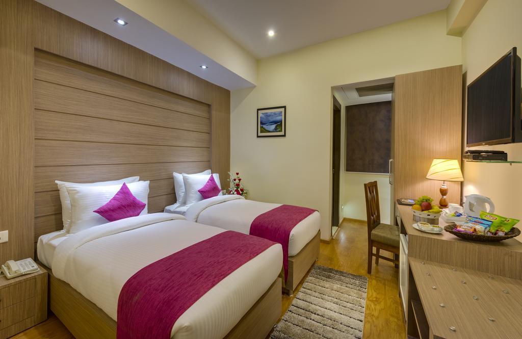 Cygnett Inn Repose Guwahati Rum bild